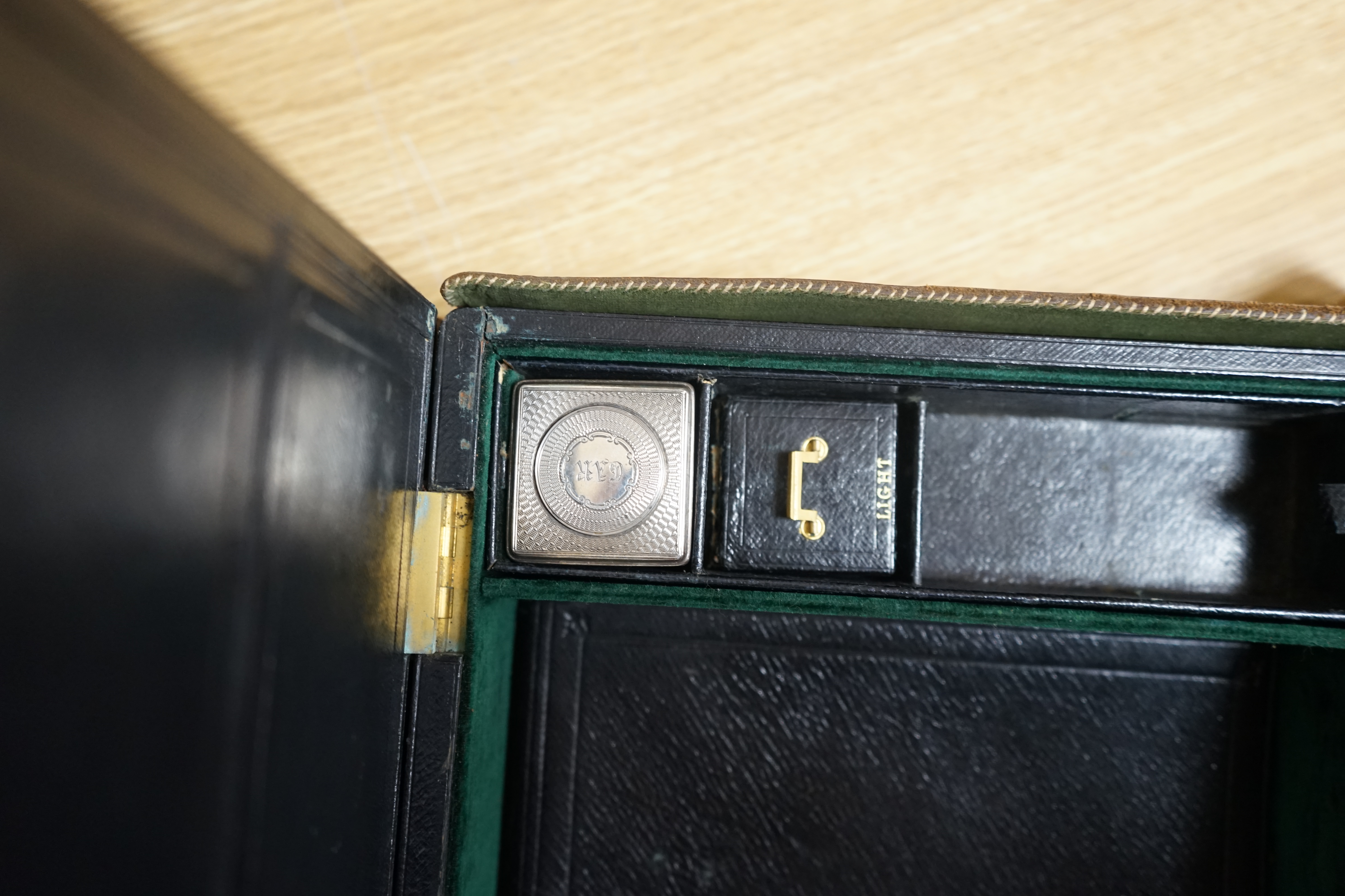 Wells & Lambert, London, a travelling writing box and outer leather case, with Bramah lock and keys, with monograms and inscriptions of Rev. George A. Robins, the box incorporating a silver lidded inkwell, 33cm wide. Con